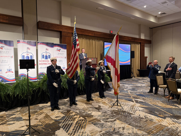 JROTC honor guard members in uniform posting the American and state flags at the CLAS Banner Schools Awards Luncheon ceremony